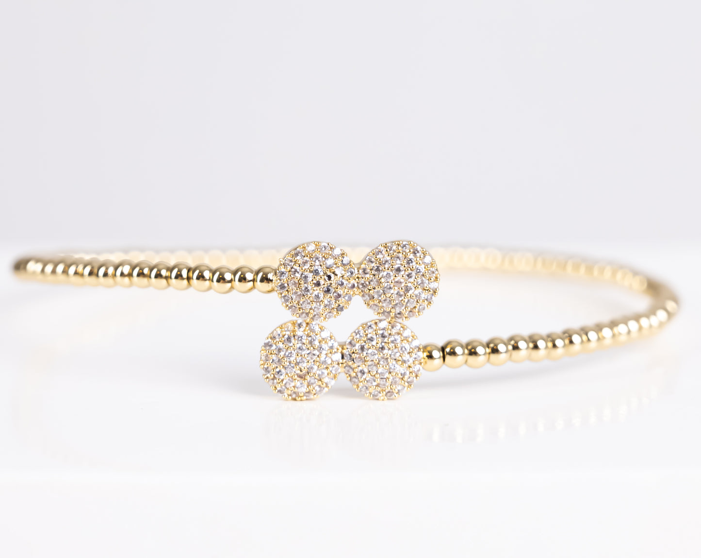 Gold two stone bangle bracelet