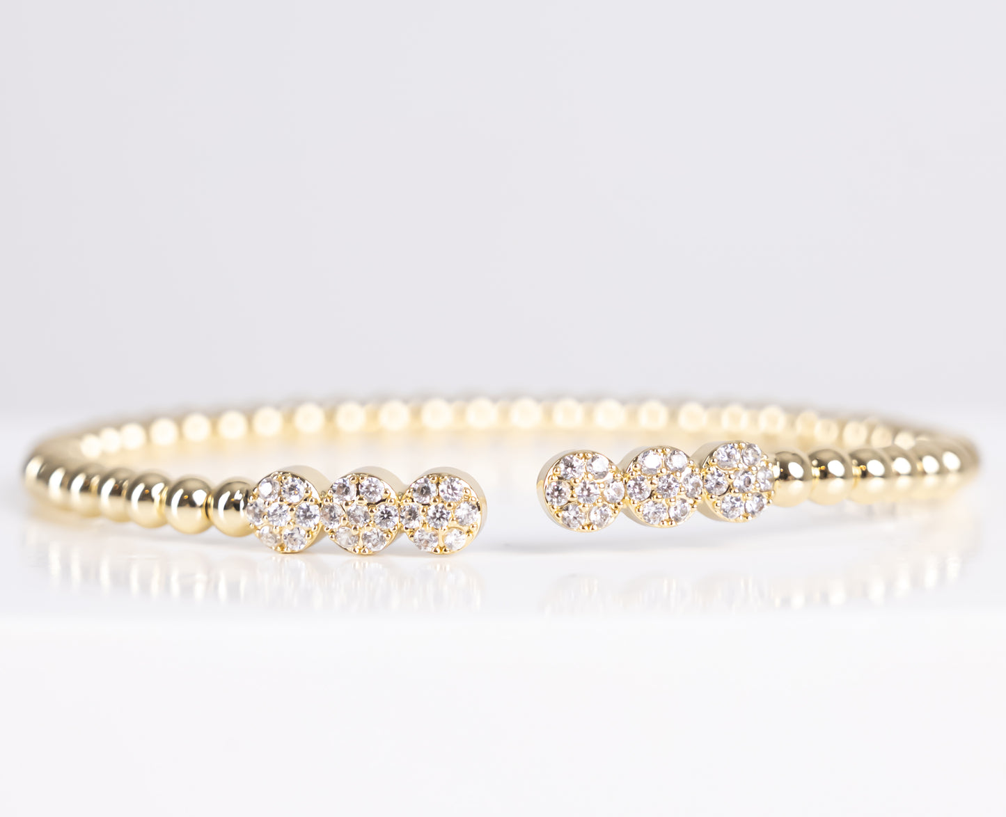 Gold triple stone bangle bracelet
