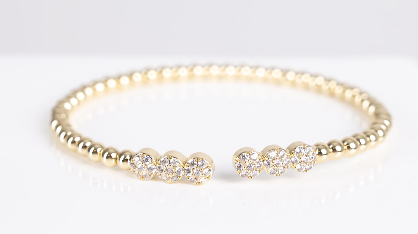 Gold triple stone bangle bracelet