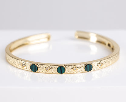 Gold bracelet with green stone