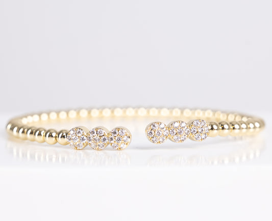 Gold triple stone bangle bracelet