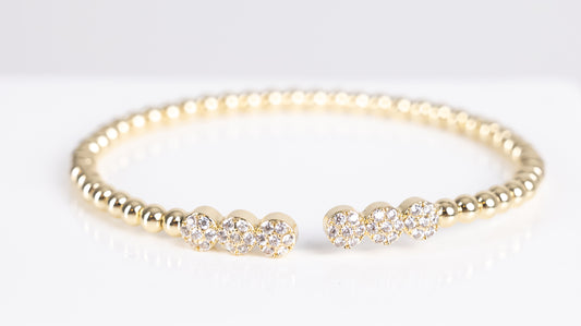 Gold triple stone bangle bracelet