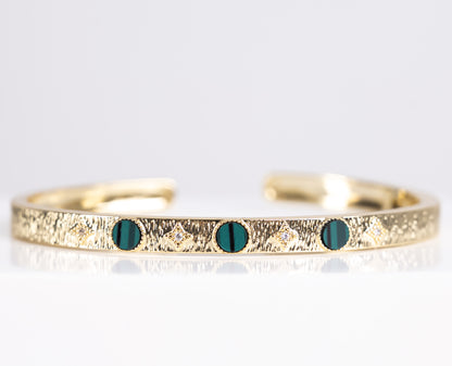 Gold bracelet with green stone