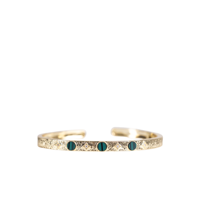 Gold bracelet with green stone